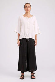 Model Genericm wearing size sample of the Studio Linen Button Top Jacket – White in colour White, from the front