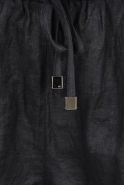 Product shot of the Studio Linen Bermuda Short – Black in colour Black, showing detail
