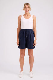 Model Genericm wearing size sample of the Studio Linen Bermuda Short – Navy in colour Navy, from the front