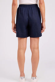 Model Genericm wearing size sample of the Studio Linen Bermuda Short – Navy in colour Navy, from the front