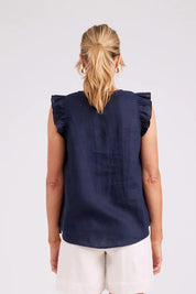 Model Genericm wearing size sample of the Studio Linen Frill Tank – Navy in colour Navy, from the back