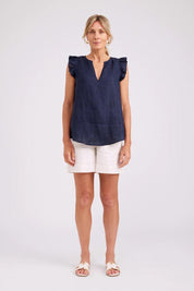 Model Genericm wearing size sample of the Studio Linen Frill Tank – Navy in colour Navy, from the front