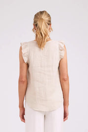 Model Genericm wearing size sample of the Studio Linen Frill Tank – Tusk in colour Tusk, from the back
