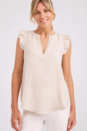 Model Genericm wearing size sample of the Studio Linen Frill Tank – Tusk in colour Tusk, in a cropped view