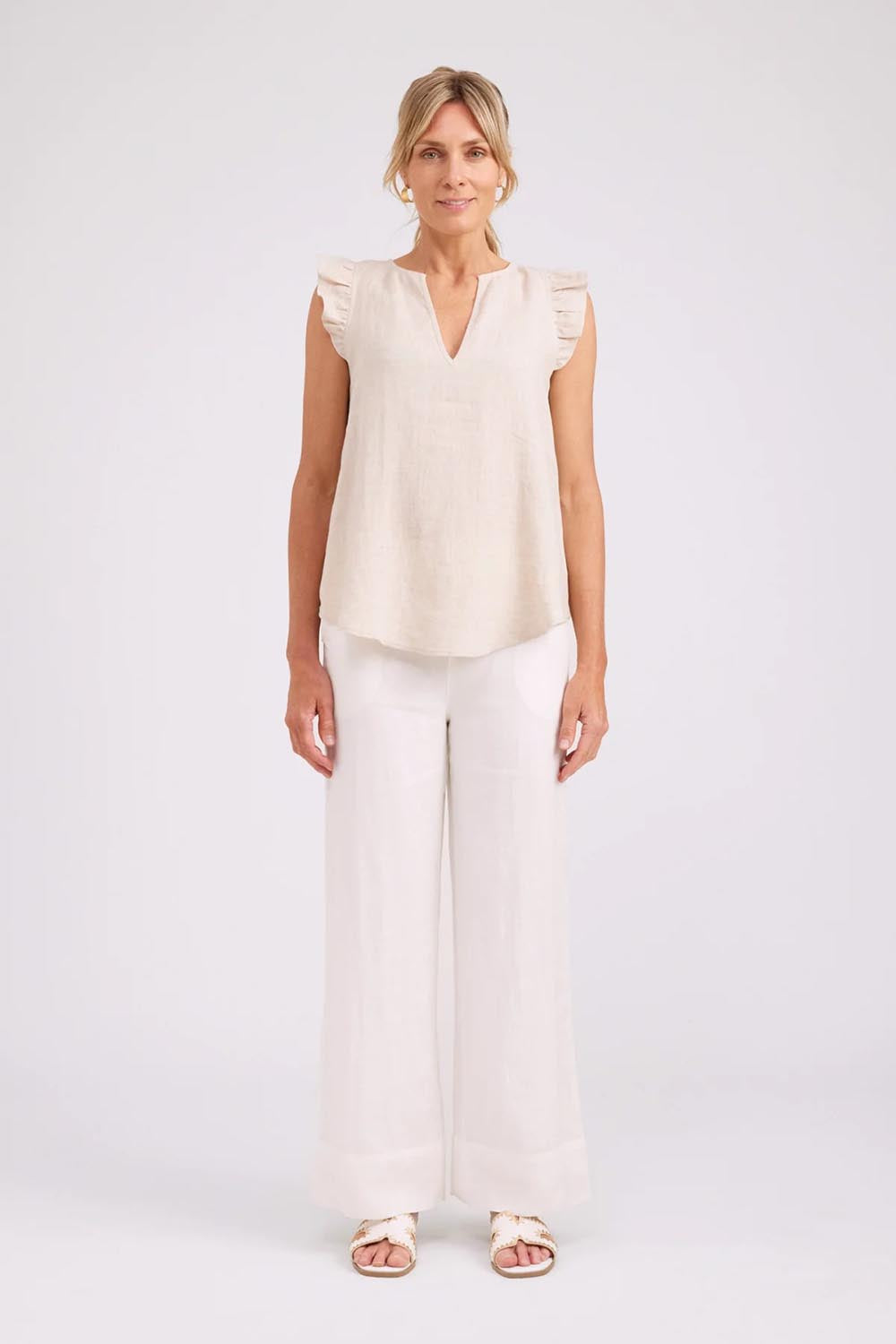 Model Genericm wearing size sample of the Studio Linen Frill Tank – Tusk in colour Tusk, from the front
