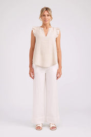 Model Genericm wearing size sample of the Studio Linen Frill Tank – Tusk in colour Tusk, from the front