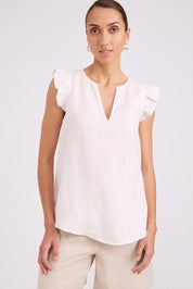 Model Genericm wearing size sample of the Studio Linen Frill Tank – White in colour White, in a cropped view