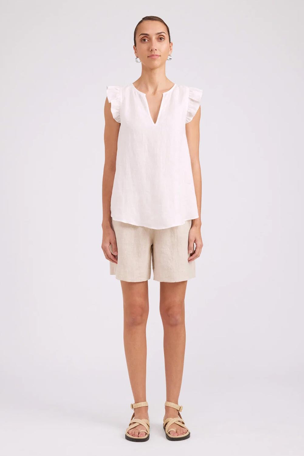 Model Genericm wearing size sample of the Studio Linen Frill Tank – White in colour White, from the front