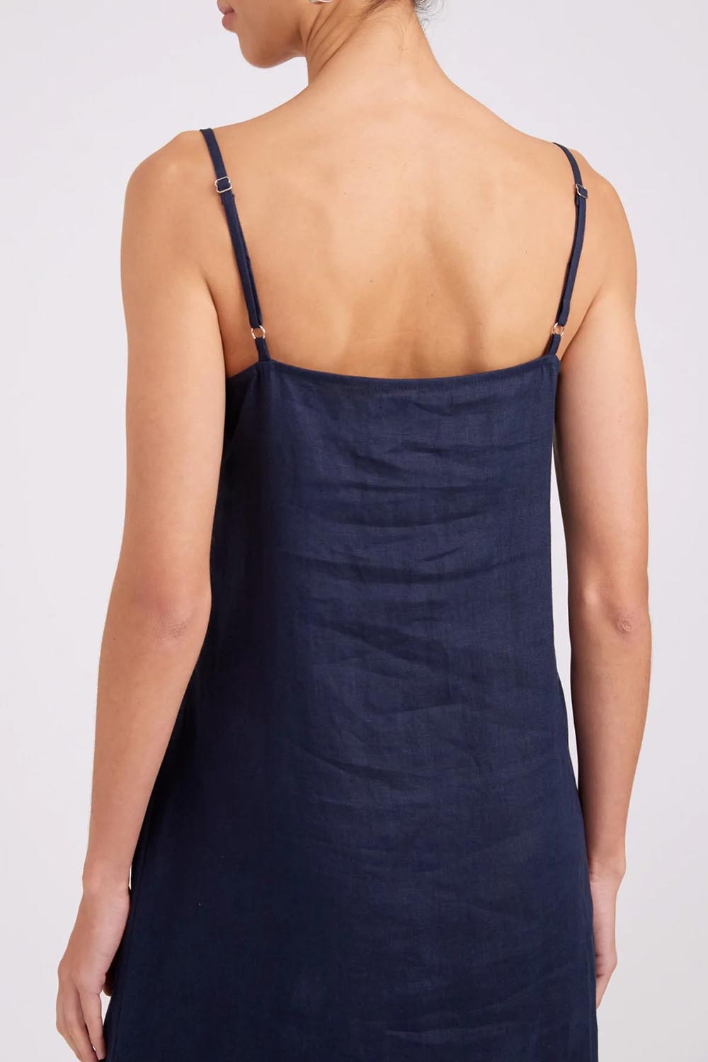 Model Genericm wearing size sample of the Studio Linen Tank Maxi Dress – Navy in colour Navy, from the back