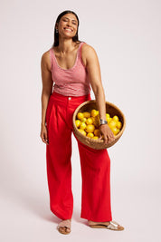 Model Genericm wearing size sample of the Cove Palazzo Pant – Aperol in colour Aperol, from the front