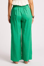 Model Genericm wearing size sample of the Cove Palazzo Pant – Jade in colour Jade, from the back