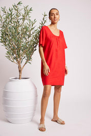Model Genericm wearing size sample of the Cove Dress – Aperol in colour Aperol, from the front