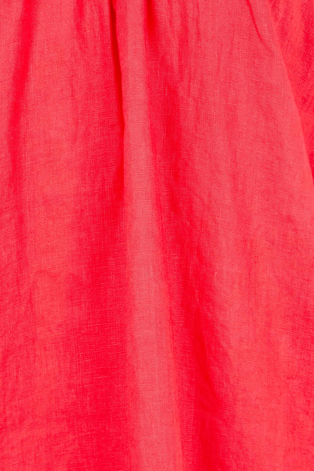 Product shot of the Cove Linen Dress – Aperol in colour Aperol, showing detail