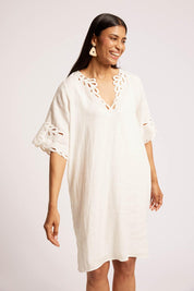Model Genericm wearing size sample of the Maris Dress – Tusk in colour Tusk, from an angle