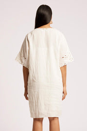 Model Genericm wearing size sample of the Maris Dress – Tusk in colour Tusk, from the back