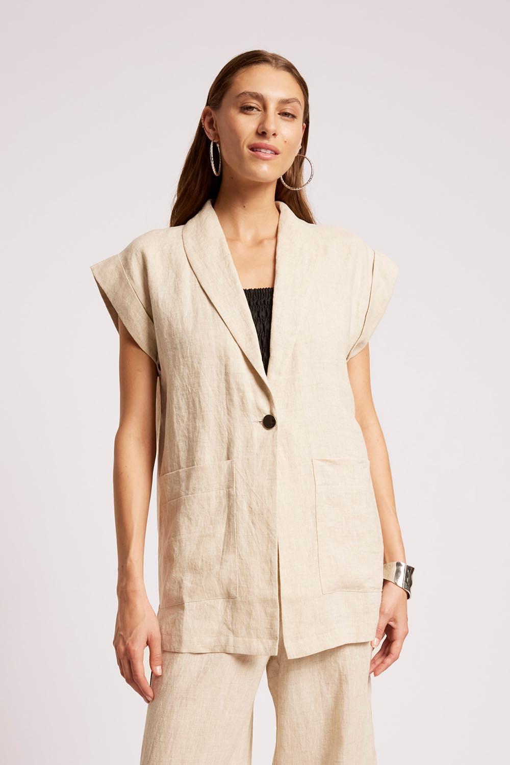 Model Genericm wearing size sample of the Maris Blazer Vest - Tusk in colour Tusk, in a cropped view