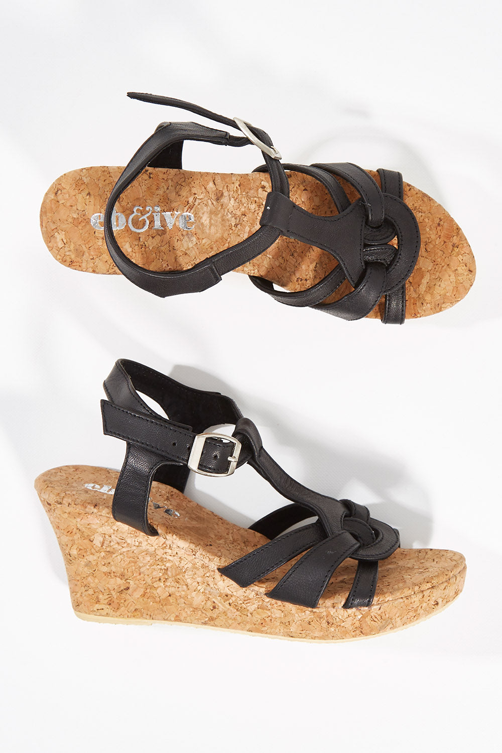 A model wearing size 37 of the Londolozi Wedge Heel in colour Black (Black), from the front, showing the whole outfit