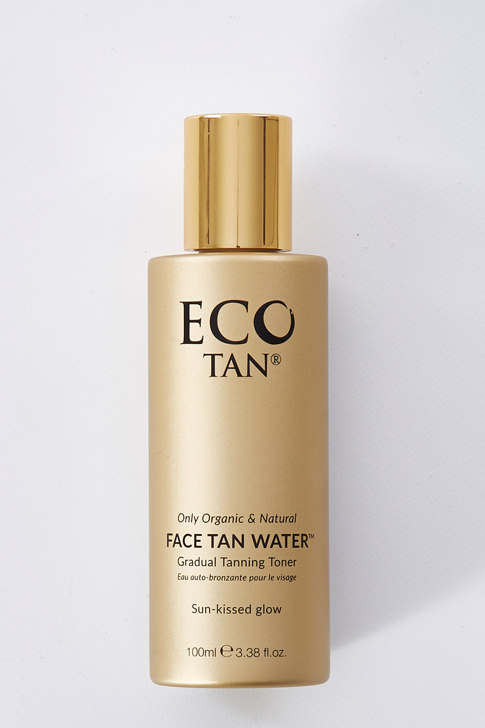 A model wearing size OneSize of the Face Tan Water in colour Tan, from the front, showing the whole outfit