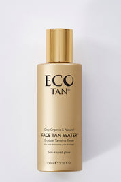 A model wearing size OneSize of the Face Tan Water in colour Tan, from the front, showing the whole outfit