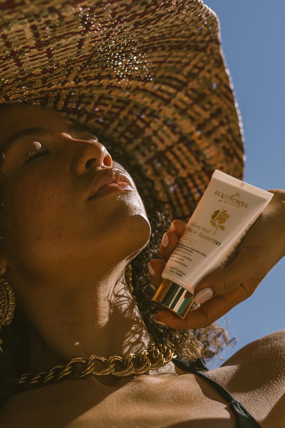 A model wearing the Glory Veil Face Sunscreen Spf 50 in colour White (White), from the front, showing the whole outfit