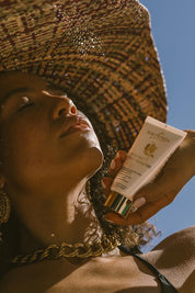 A model wearing the Glory Veil Face Sunscreen Spf 50 in colour White (White), from the front, showing the whole outfit