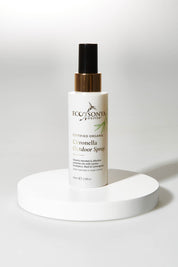 A model wearing size OneSize of the Organic Personal Outdoor Spray in colour Natural, from the front, showing the whole outfit