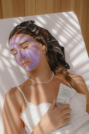 A model wearing the Face Compost Purple Power Mask in colour Natural, from the front, showing the whole outfit