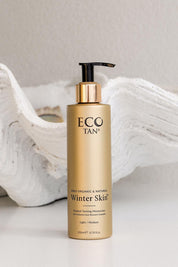A model wearing the Organic Winter Skin in colour Naturals, from the front, showing the whole outfit