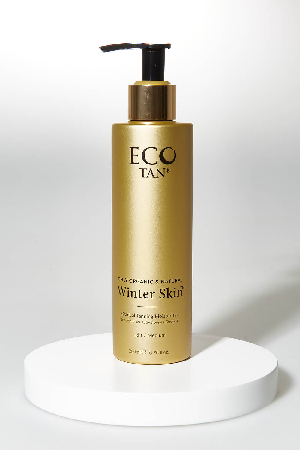 A model wearing the Organic Winter Skin in colour Naturals, from the front, showing the whole outfit