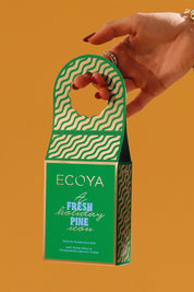 A model wearing the Festive Fragrance Duo in colour Freshpine (Green), from the front, showing the whole outfit
