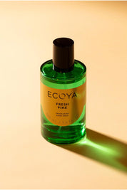 A model wearing the Festive Fragrance Duo in colour Freshpine (Green), from the front, showing the whole outfit