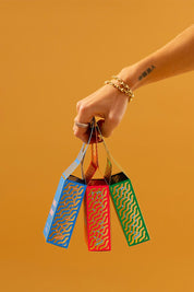 A model wearing the Festive Fragrance Duo in colour Freshpine (Green), from the front, showing the whole outfit