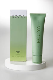 A model wearing size OneSize of the French Pear Hand Cream in colour FrenchPear (Green), from the front, showing the whole outfit
