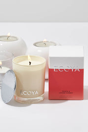 A model wearing the Mini Madison Jar Guava And Lychee Candle in colour GuavaLyche (White), from the front, showing the whole outfit