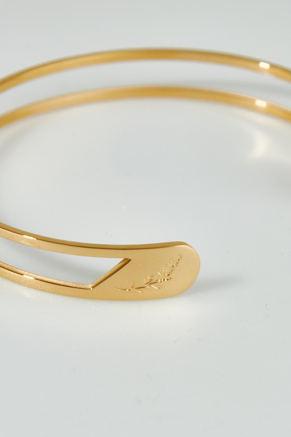 A model wearing the Faith Like A Mustard Seed Cuff Bracelet in colour Gold (Metallics), from the front, showing the whole outfit