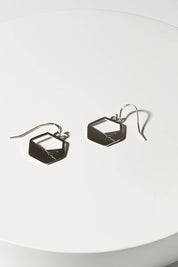 A model wearing size OneSize of The Haymar Earrings in colour Steel (Metallics), from the front, showing the whole outfit