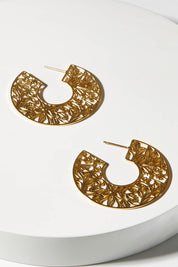 A model wearing size OneSize of the I Am Brave Earrings in colour Gold (Metallics), from the front, showing the whole outfit