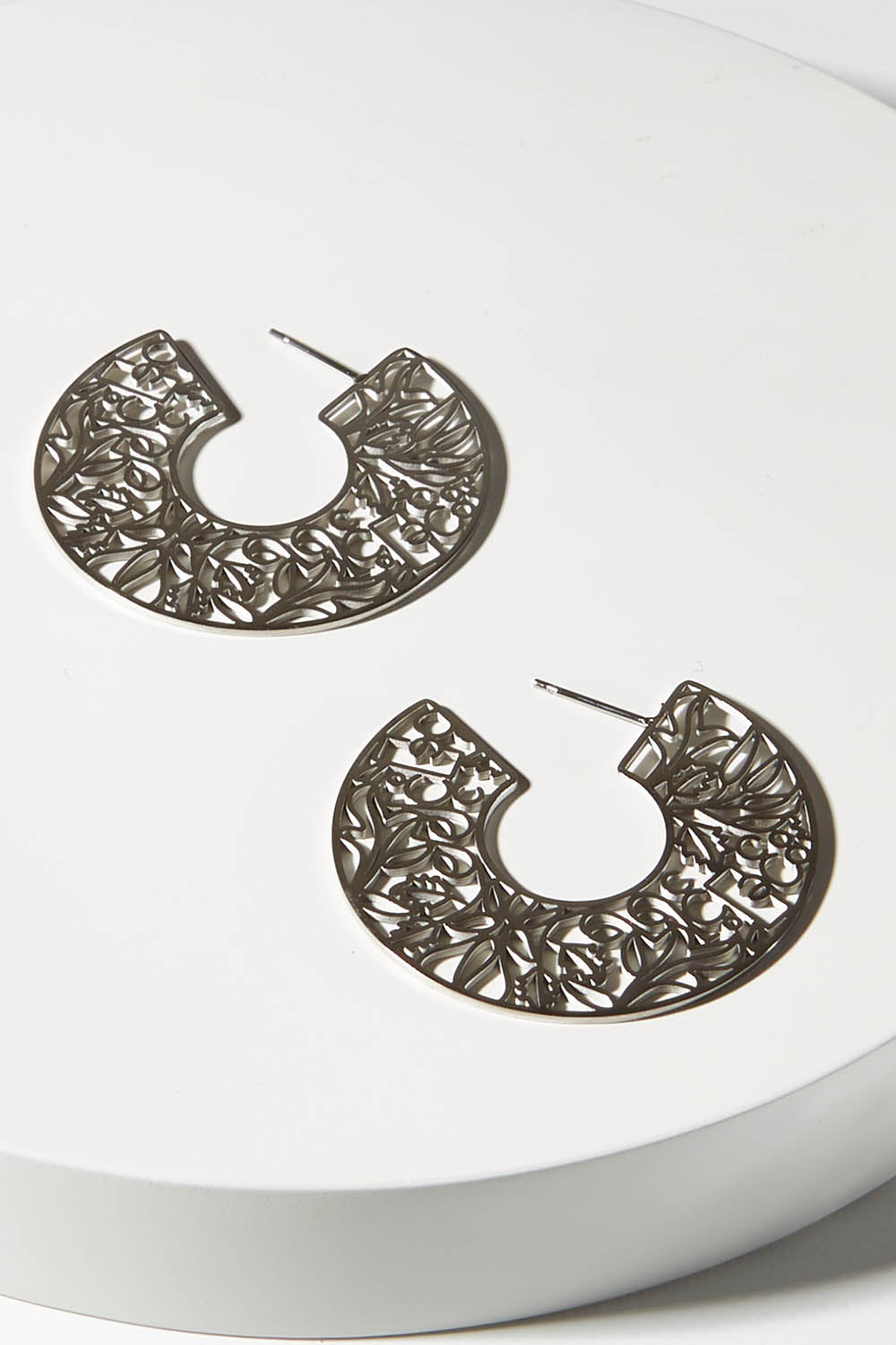 A model wearing size OneSize of the I Am Brave Earrings in colour Steel (Metallics), from the front, showing the whole outfit