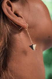 A model wearing the Be Light Beaded Earrings in colour Gold (Metallics), from the front, showing the whole outfit