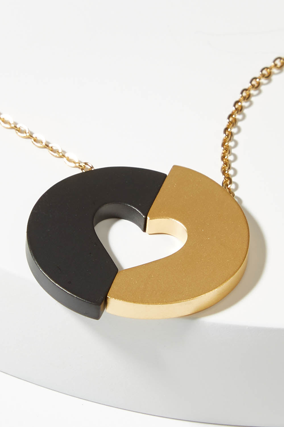 A model wearing size S of the Committed Necklace in colour Gold (Metallics), from the front, showing the whole outfit