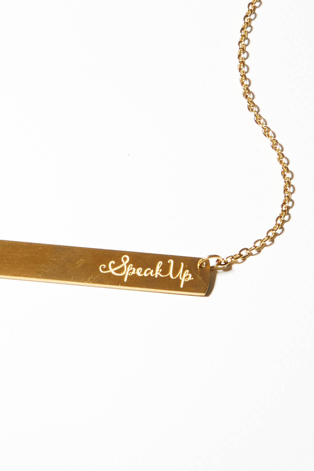 A model wearing the Speak Up Bar Necklace in colour Gold (Metallics), from the front, showing the whole outfit