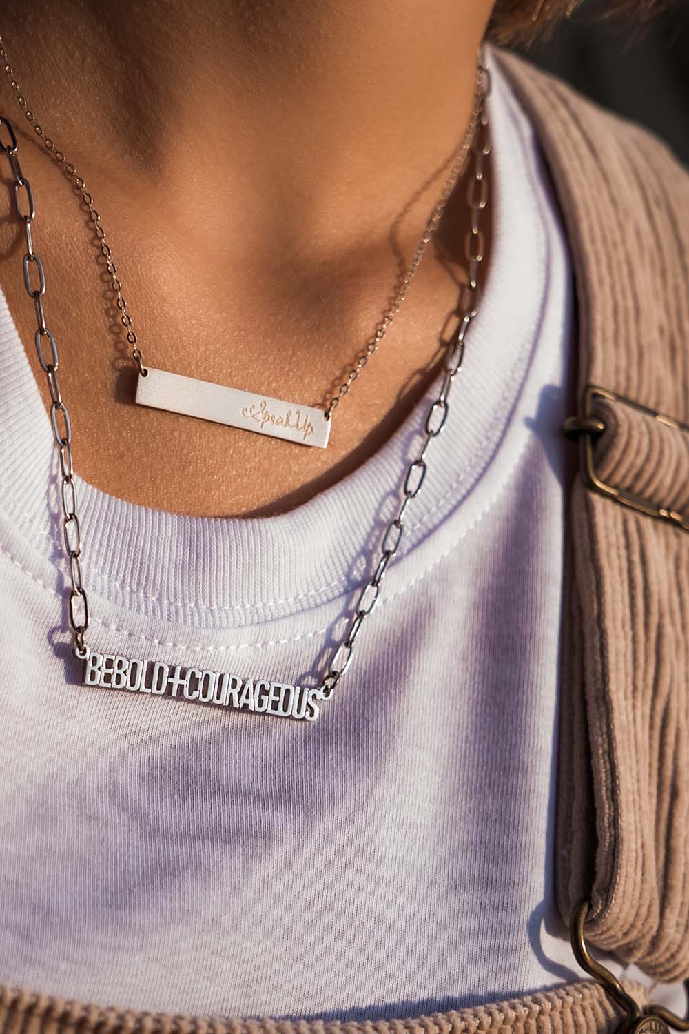 A model wearing the Speak Up Bar Necklace in colour Silver (Metallics), from the front, showing the whole outfit