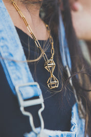 A model wearing the Time For Freedom Necklace in colour Gold (Metallics), from the front, showing the whole outfit
