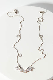 A model wearing size OneSize of the Time To Rise Necklace in colour Silver (Metallics), from the front, showing the whole outfit