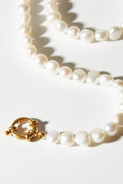 A model wearing size OneSize of the Milk And Honey Necklace in colour Gold (Metallics), from the front, showing the whole outfit