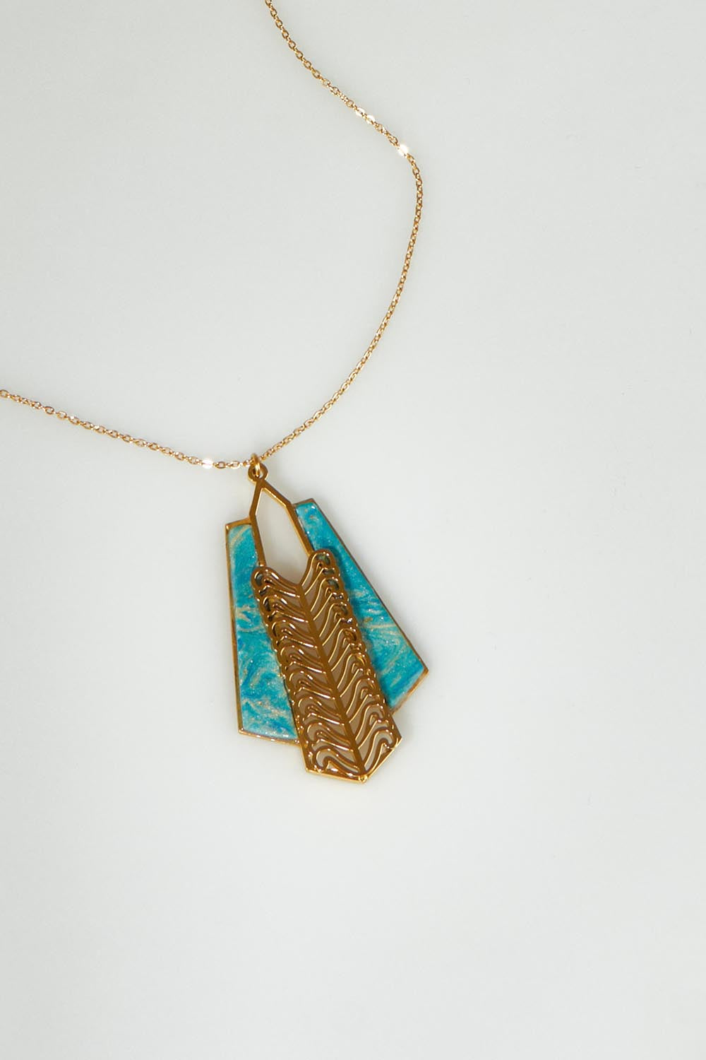 A model wearing the Parting Waters Necklace Set in colour Bluegold (Metallics), from the front, showing the whole outfit