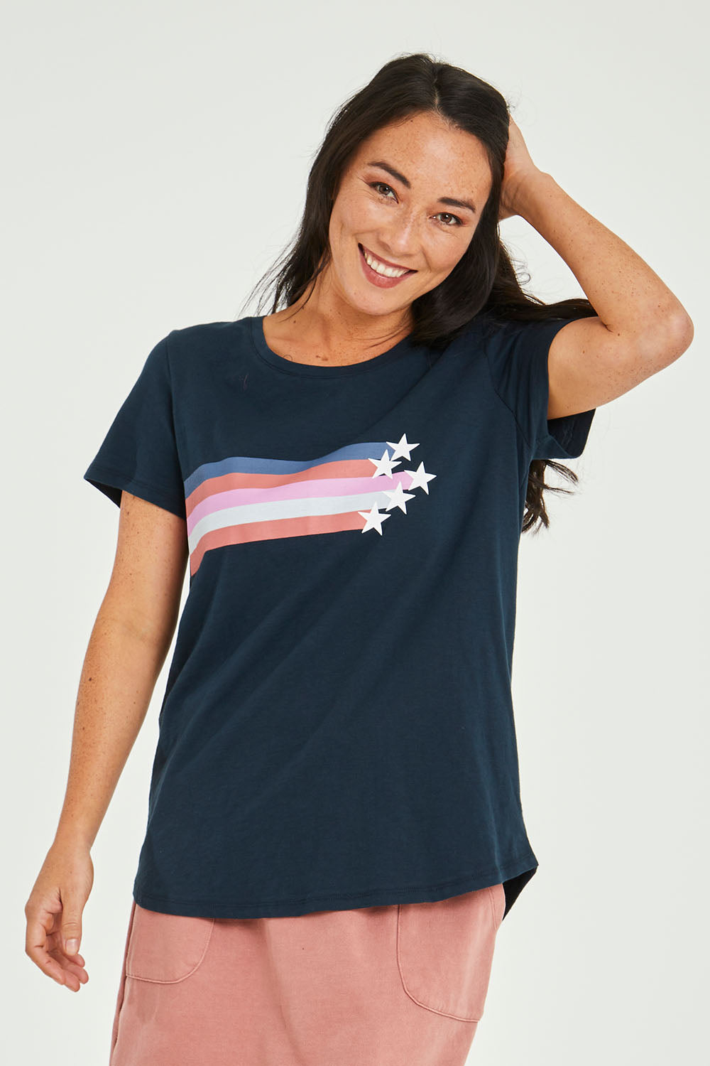 Model Katie wearing size 10 of the Seeing Stars Tee in colour Drksapp (Blue), from the front, cropped image