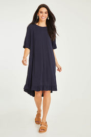 Model Stacey wearing size 10 of the Kiara Dress in colour Dsapphi (Blue), from the front, showing the whole outfit