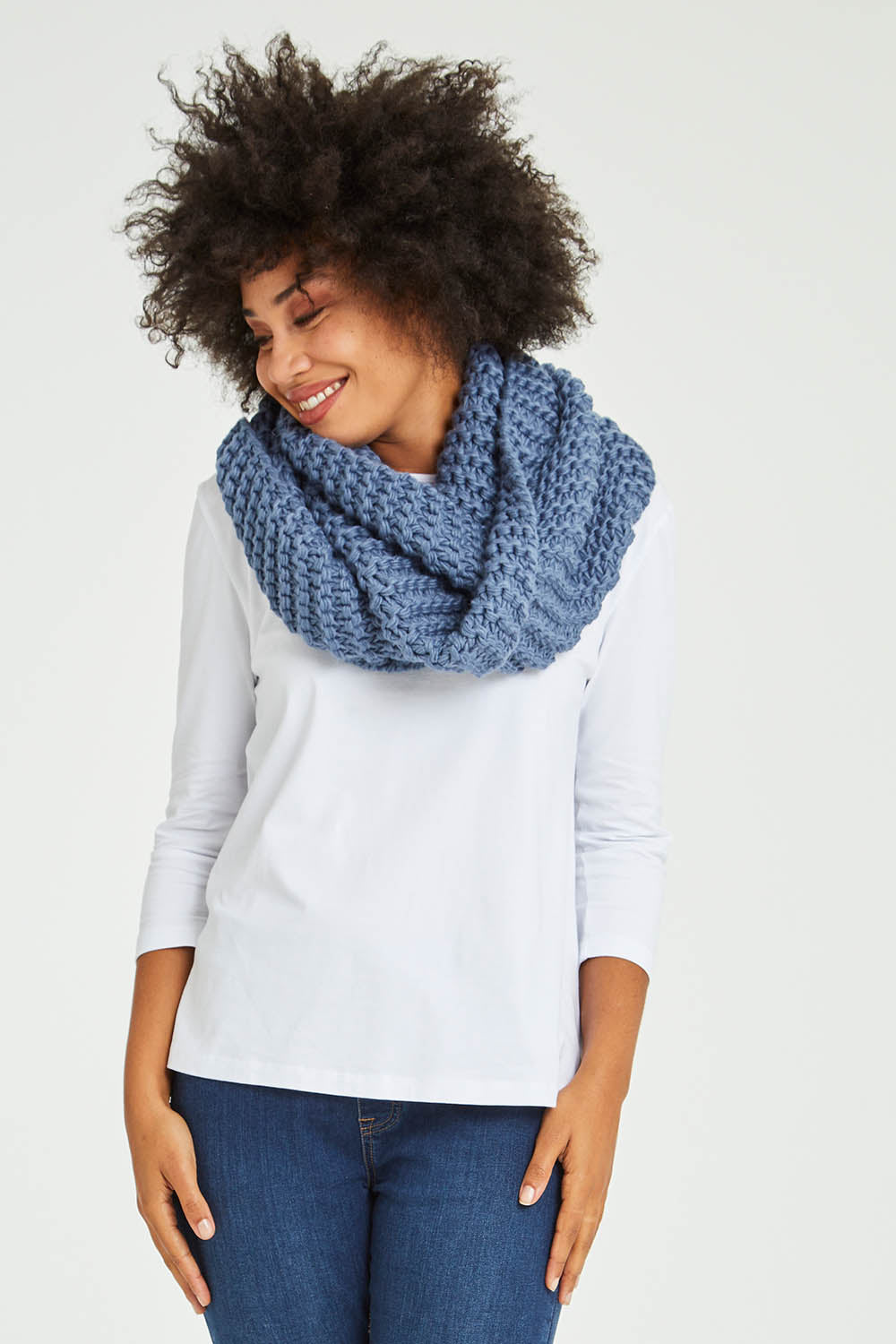 Model Olivia wearing size OneSize of the Organic Loop Scarf in colour Lightblue (Blue), from the front, showing the whole outfit