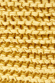 Product shot of the Organic Loop Scarf in colour Mustard, detail